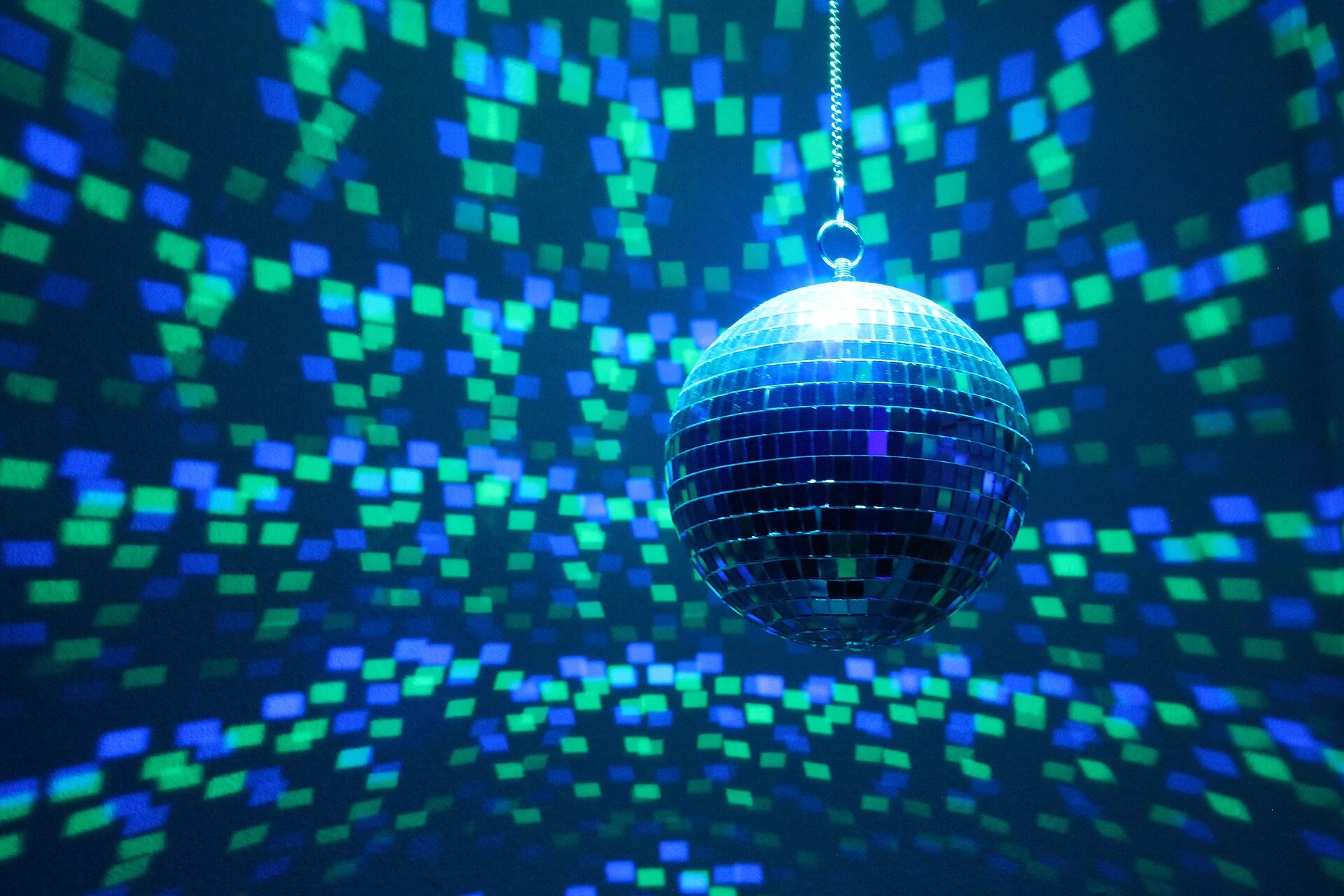A mirrored disco ball with light and motor.