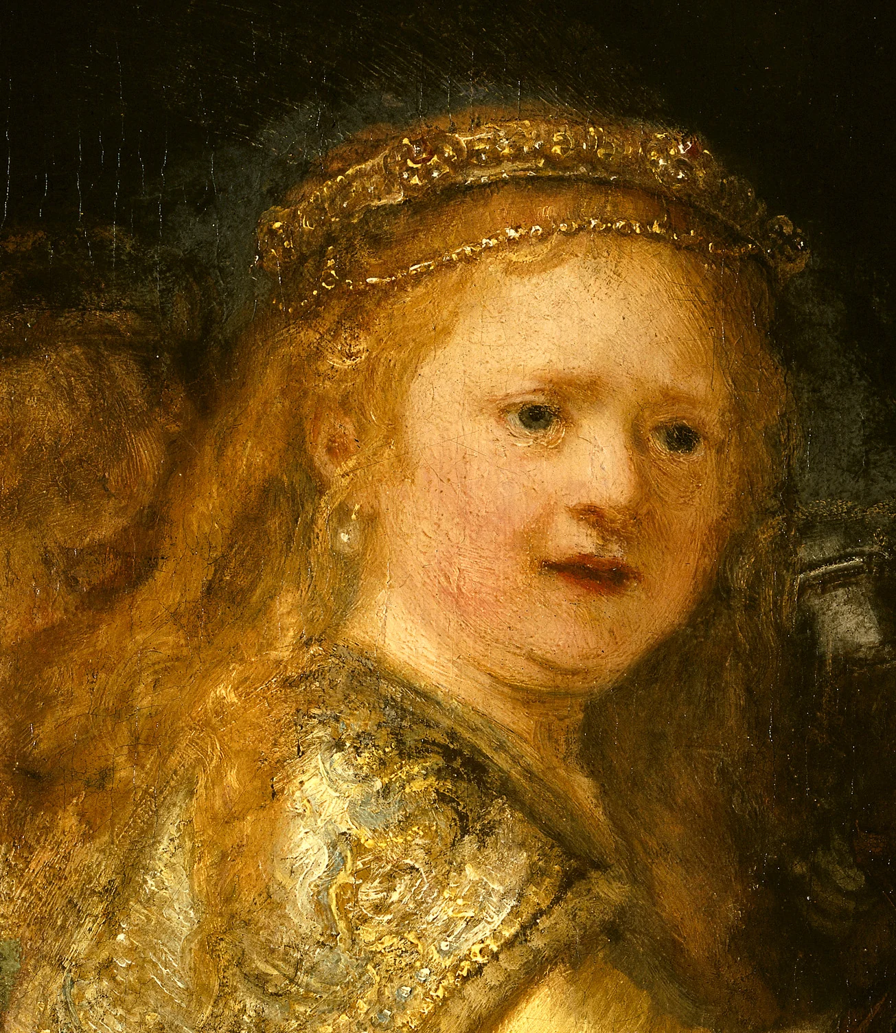 Detail van het meisje in de goudkleurige jurk op Rembrandts Nachtwacht (1642); geen opname van de huidige restauratie.